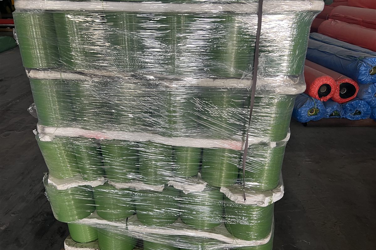Packed artificial turf rolls on pallet